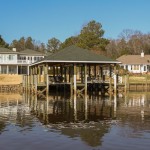 Boathouse with specilized lift for raceboat, 42' x 40' wide dual slips