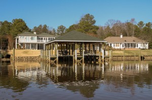 Boathouse with specilized lift for raceboat, 42' x 40' wide dual slips