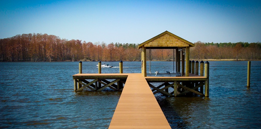 Boathouse on the Chickahominy River with 200' pier with synthetic decking, boat lift and boat slip. 